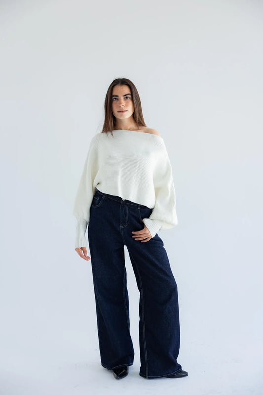 Ivory off-shoulder pullover with dark wide-leg jeans - full length