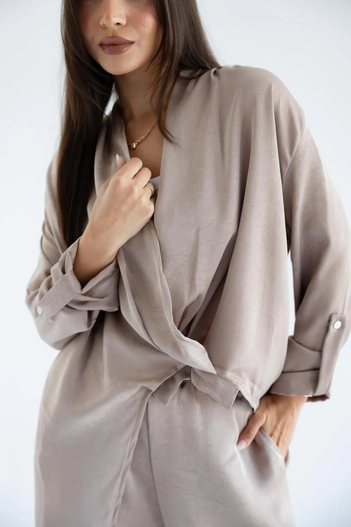 Close-up of the draped wrap front and crushed satin