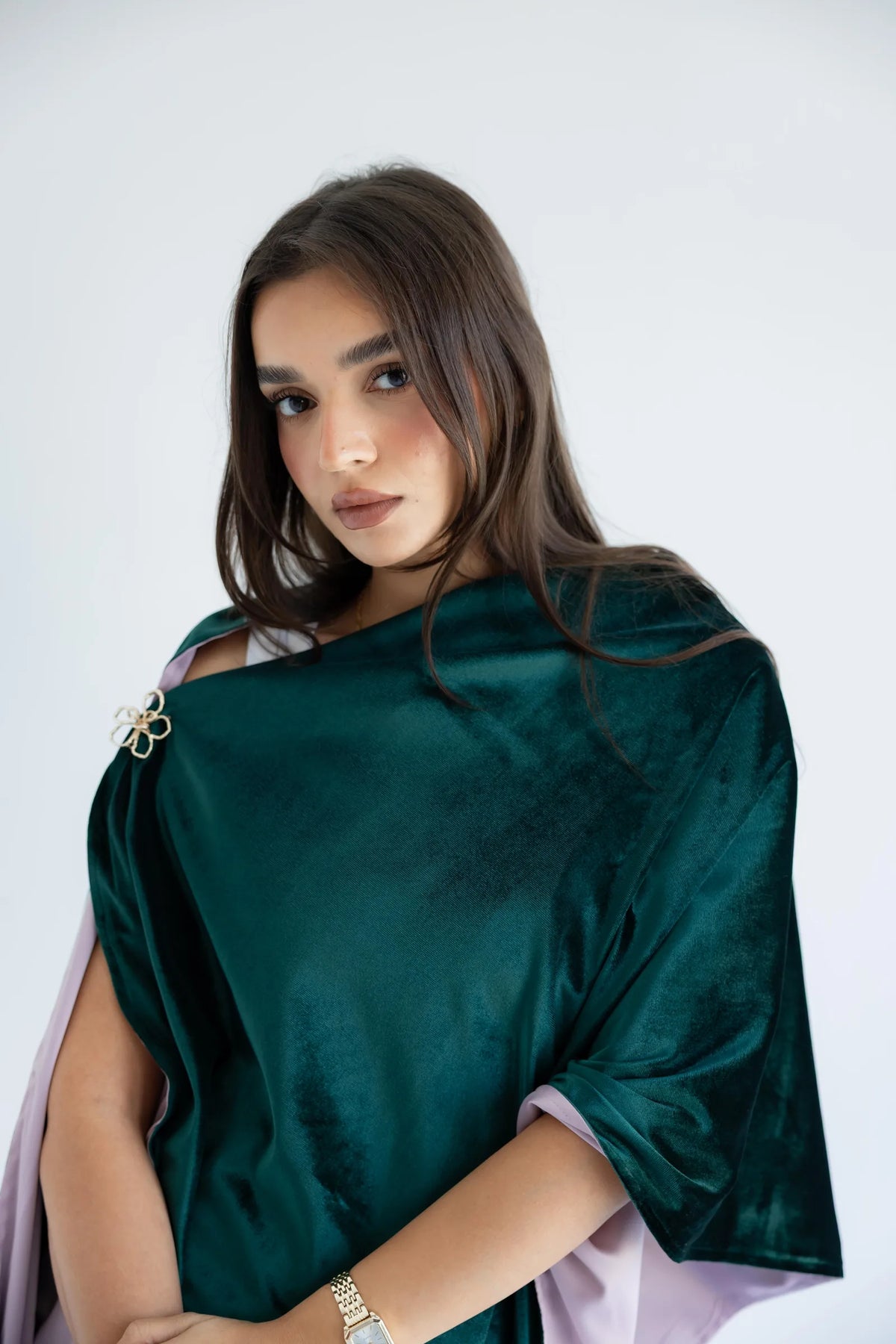 Emerald green velvet shawl draped as a poncho - front view