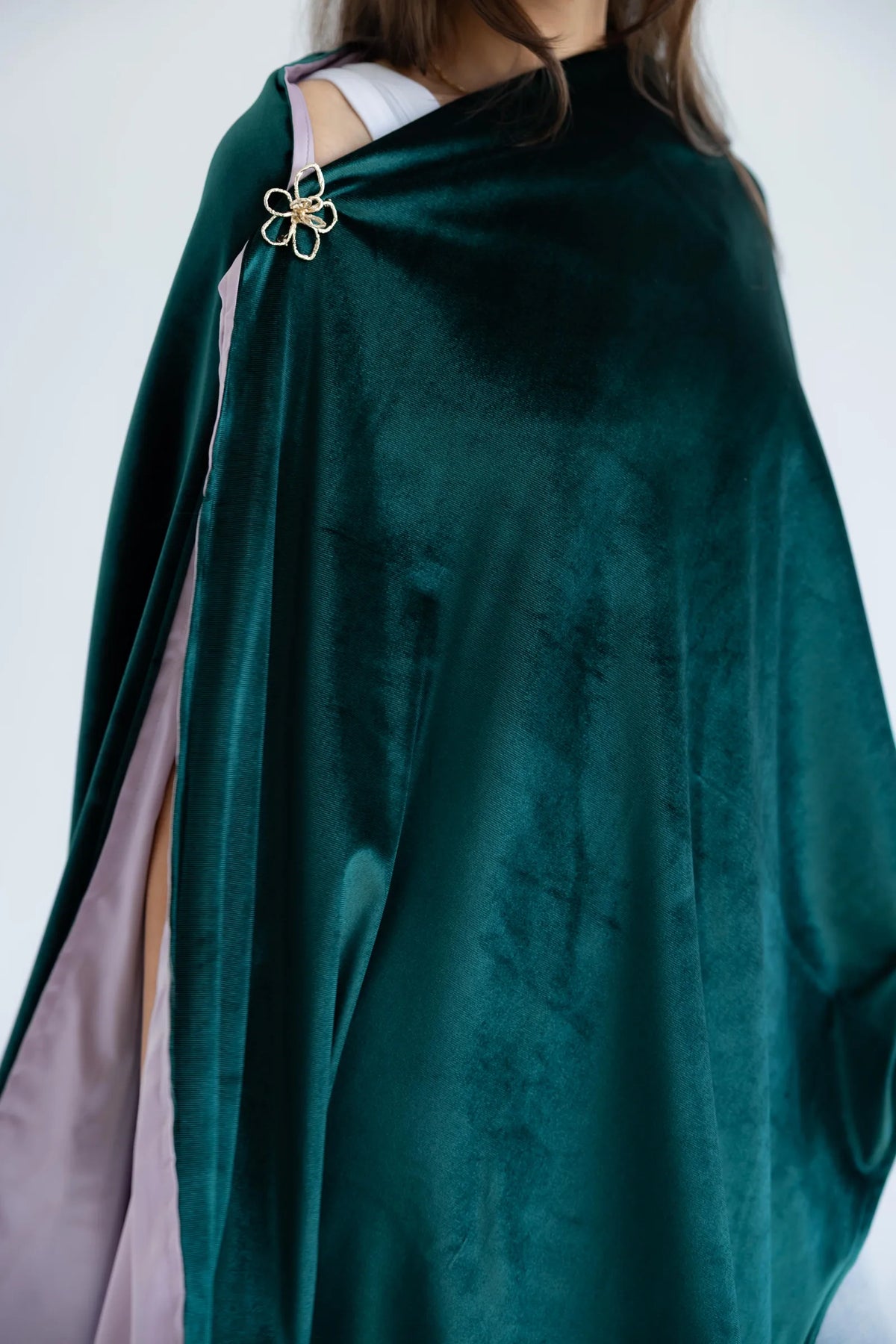 Close-up of emerald velvet and dusty pink satin lining