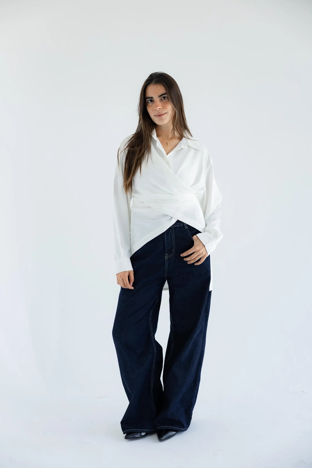White wrap shirt with dark wide-leg jeans - full length