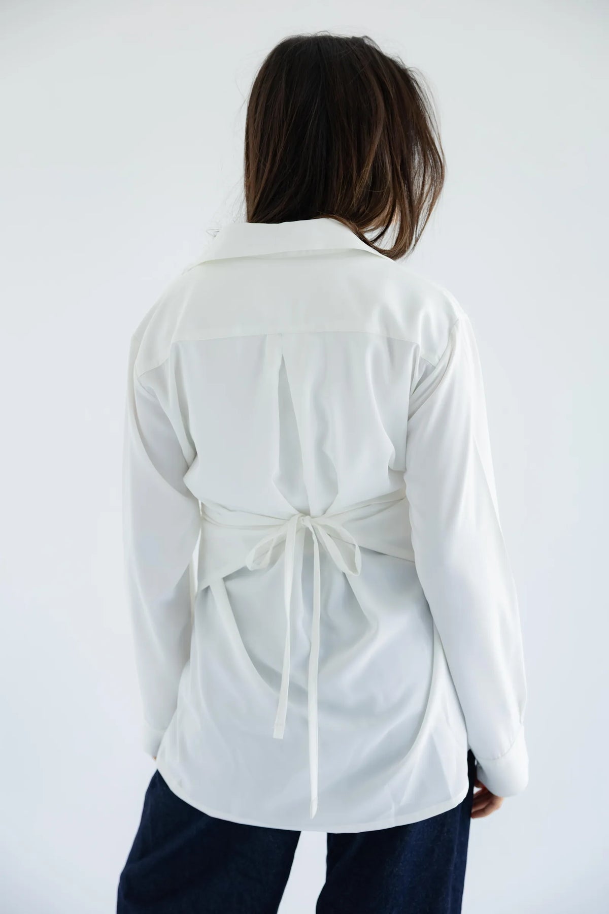 White wrap shirt - back view with tie waist