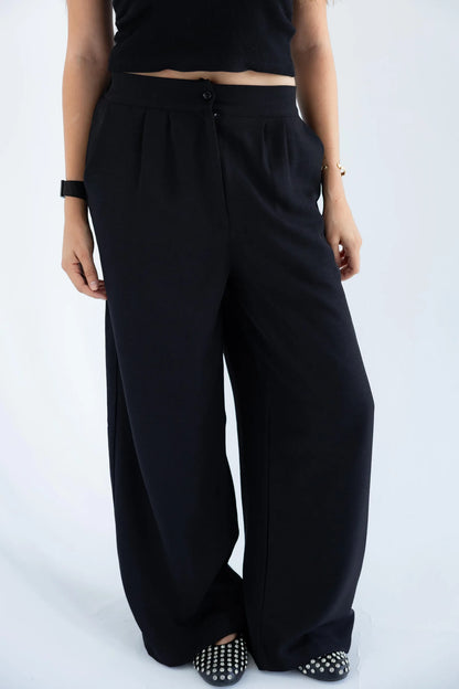 High-waisted wide-leg trousers detail