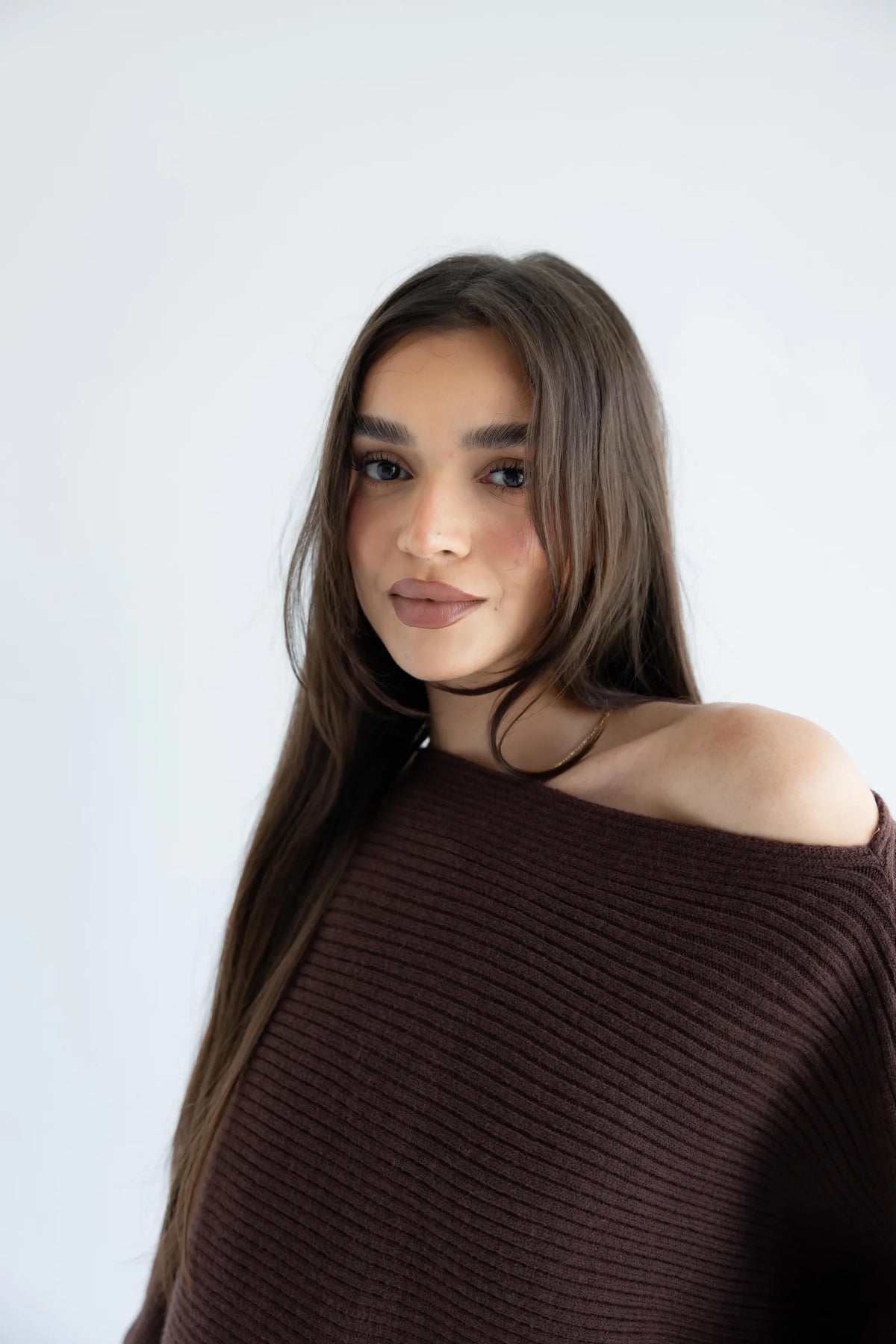 Off-shoulder boat neckline detail