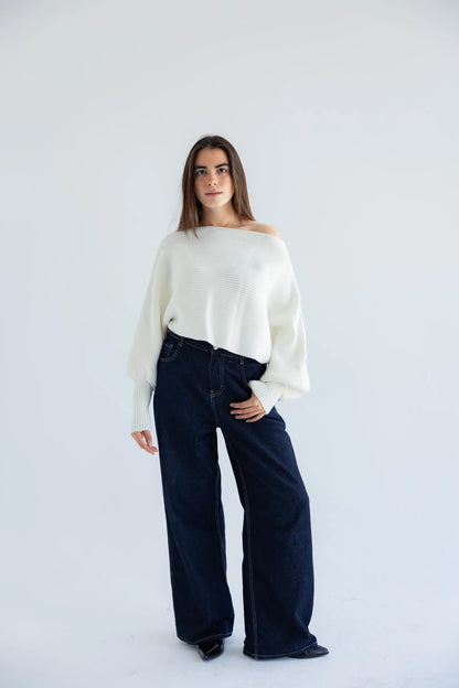Ivory off-shoulder pullover with dark wide-leg jeans - full length