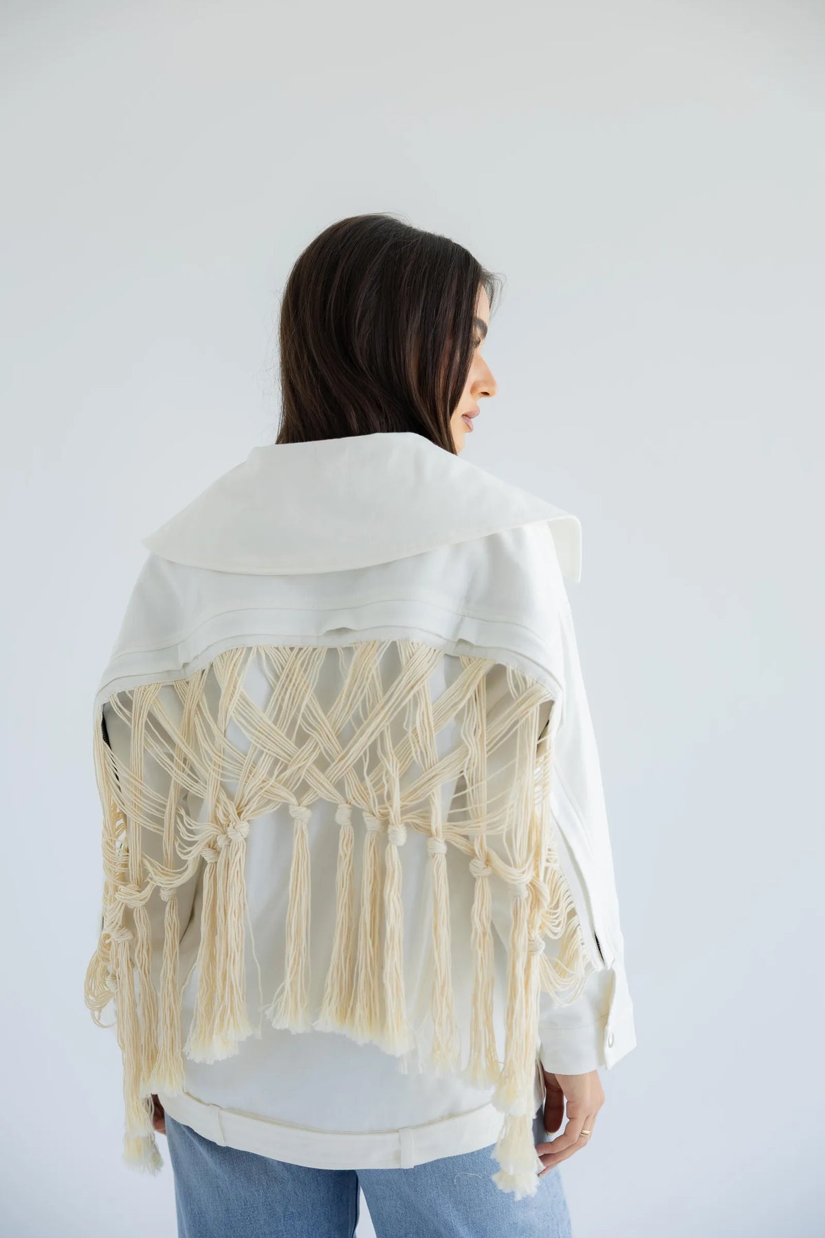 Back view showing the hand-knotted macramé fringe panel