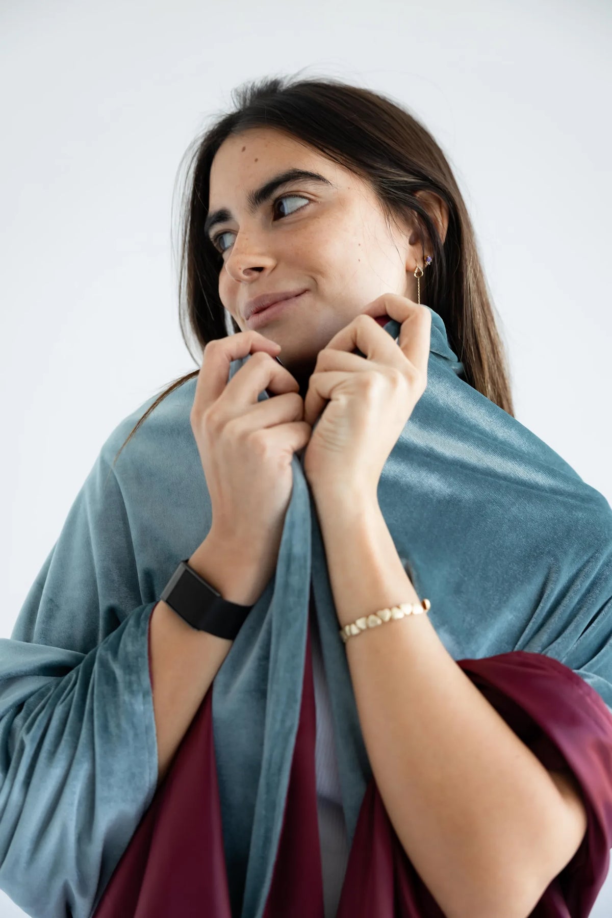 Sage and wine velvet shawl wrapped around the shoulders