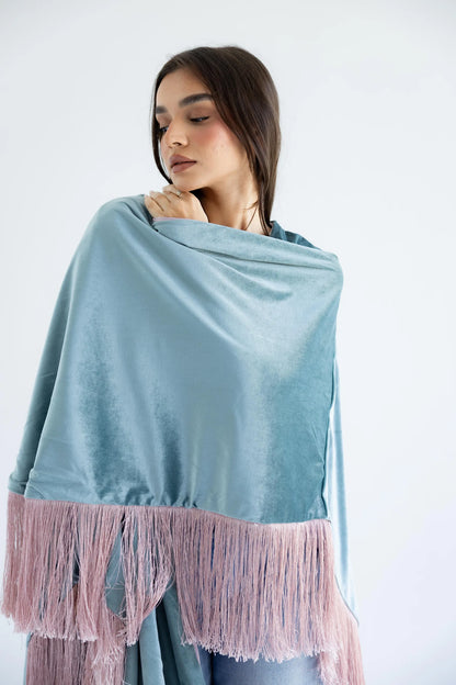 Close-up of sage velvet and rose fringe