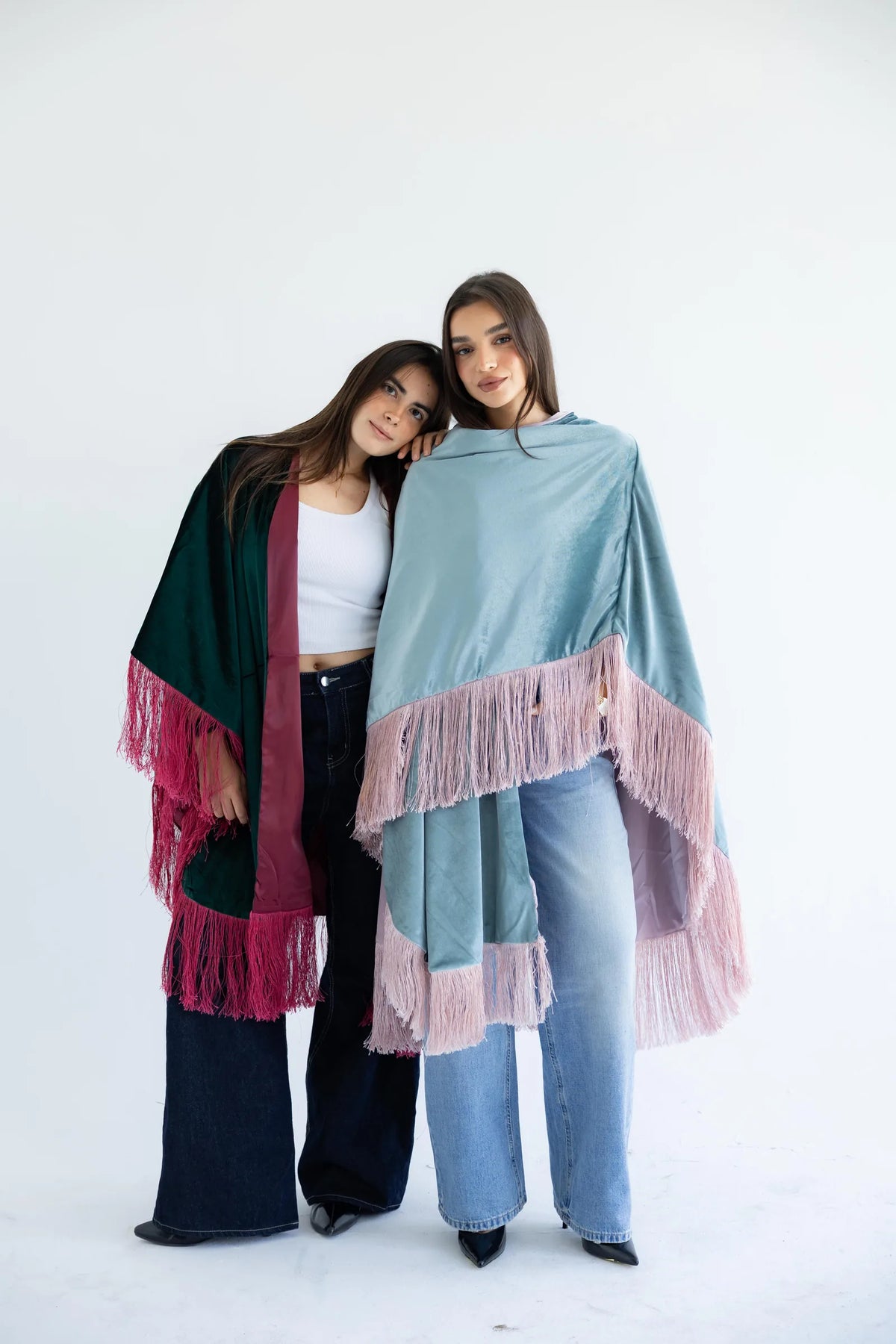 PIA fringed velvet capes in emerald and sage